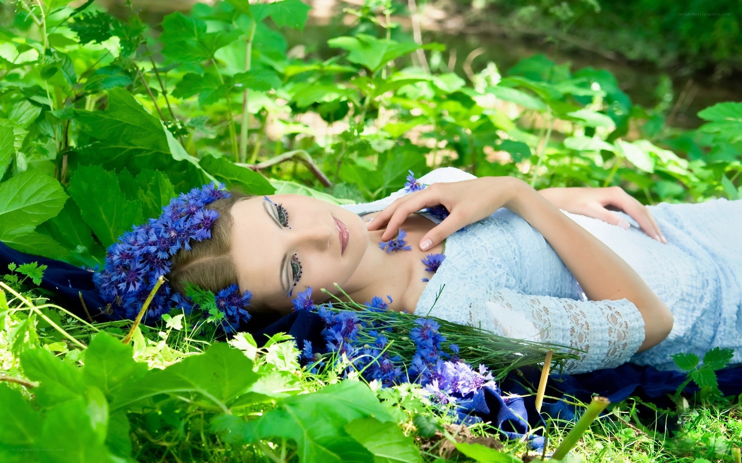Woman resting in a flower garden
