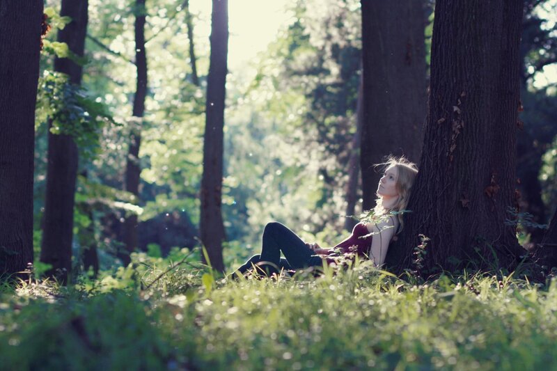 Woman resting in a forest