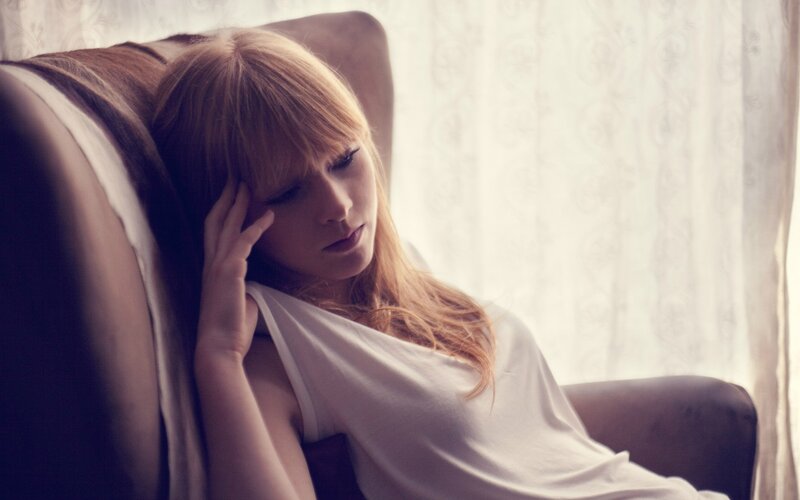 woman resting in armchair