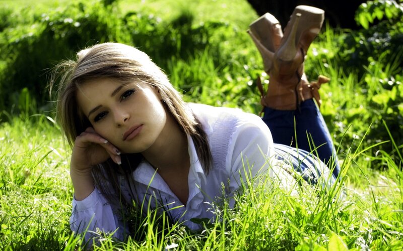 woman resting in grass