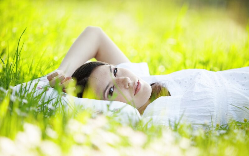 Woman resting in grass