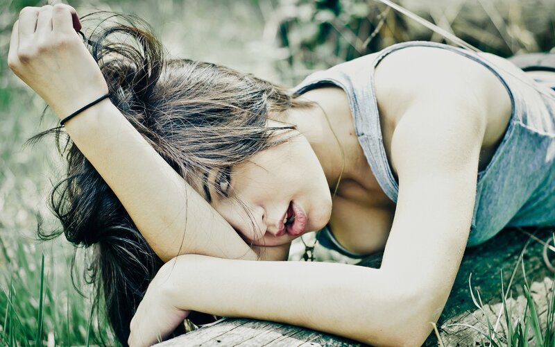 woman resting in grass