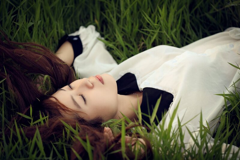 woman resting in grass