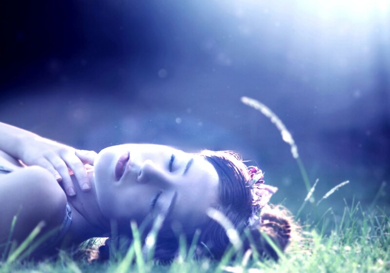 woman resting in grass