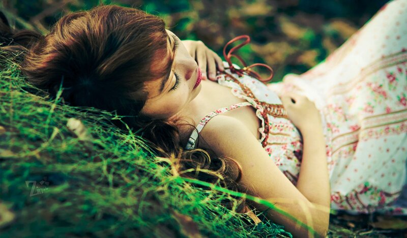 woman resting in grass
