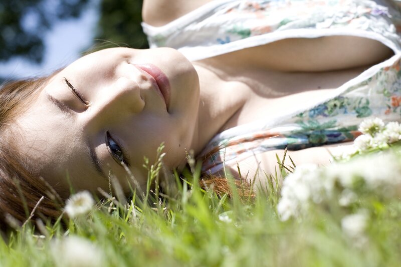 woman resting in grass