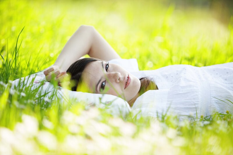 Woman resting in grass
