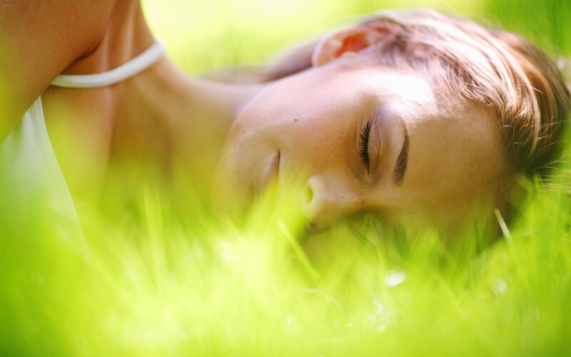 woman resting in grass