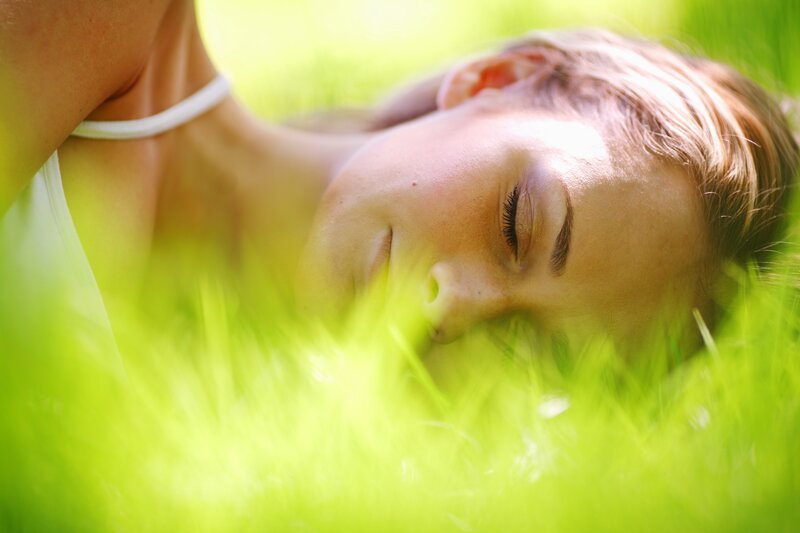 woman resting in grass