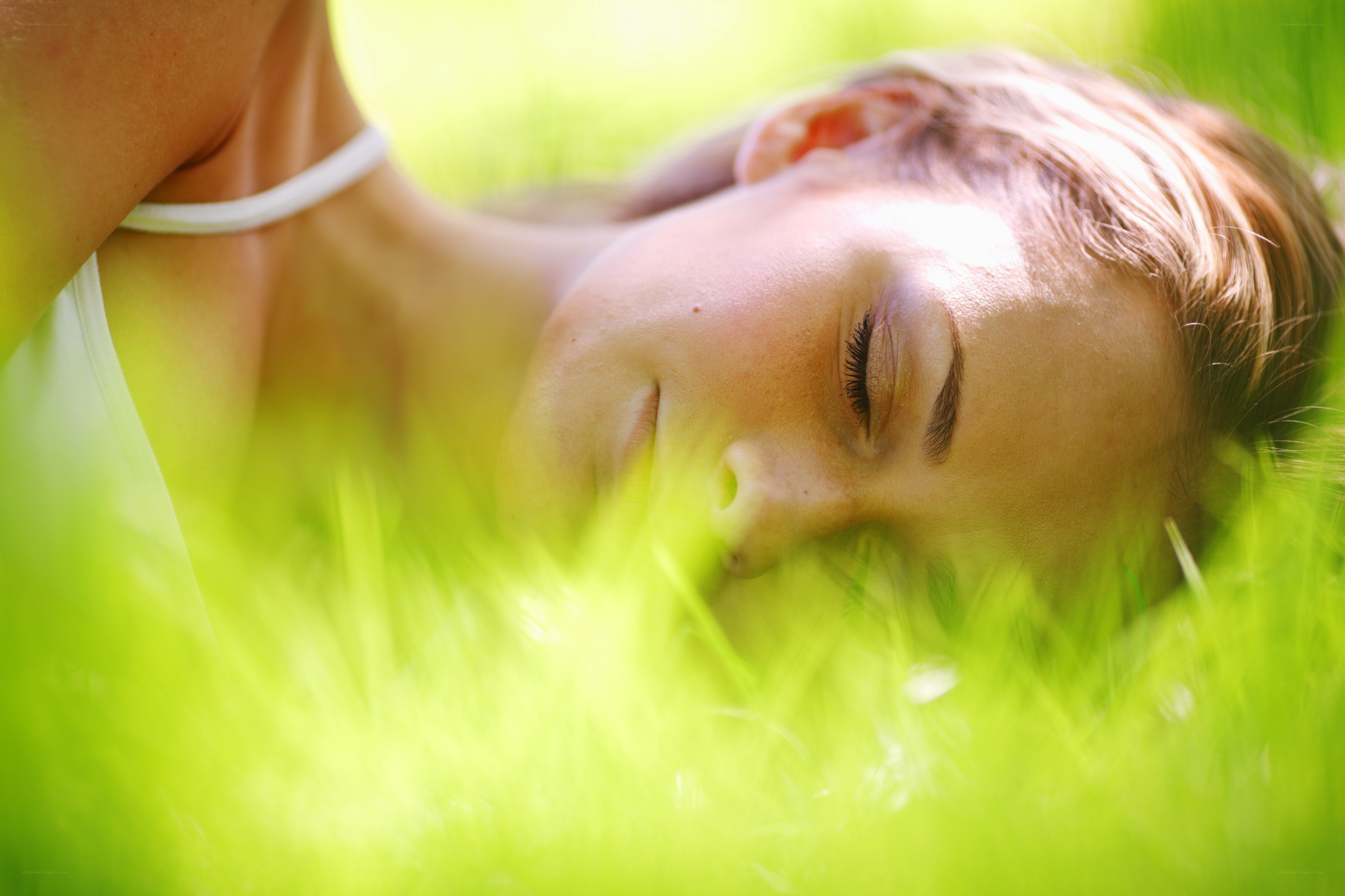 woman resting in grass
