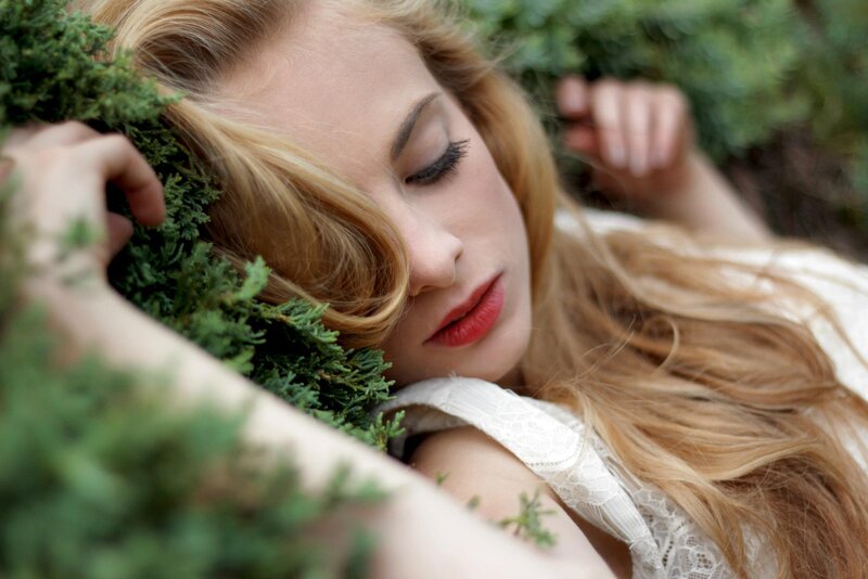 woman resting in greenery