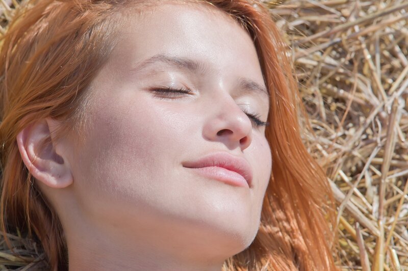woman resting in hay