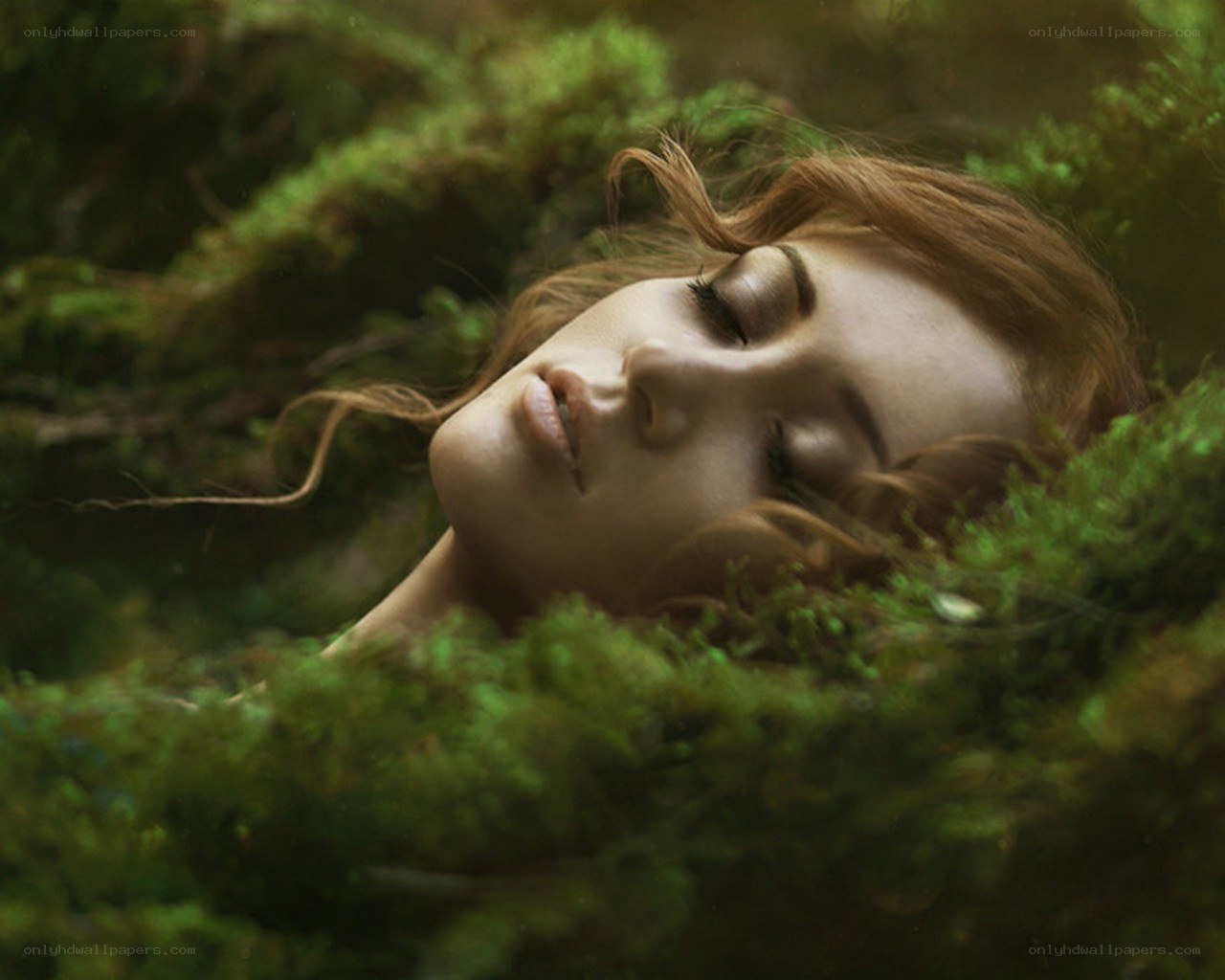 woman resting in moss