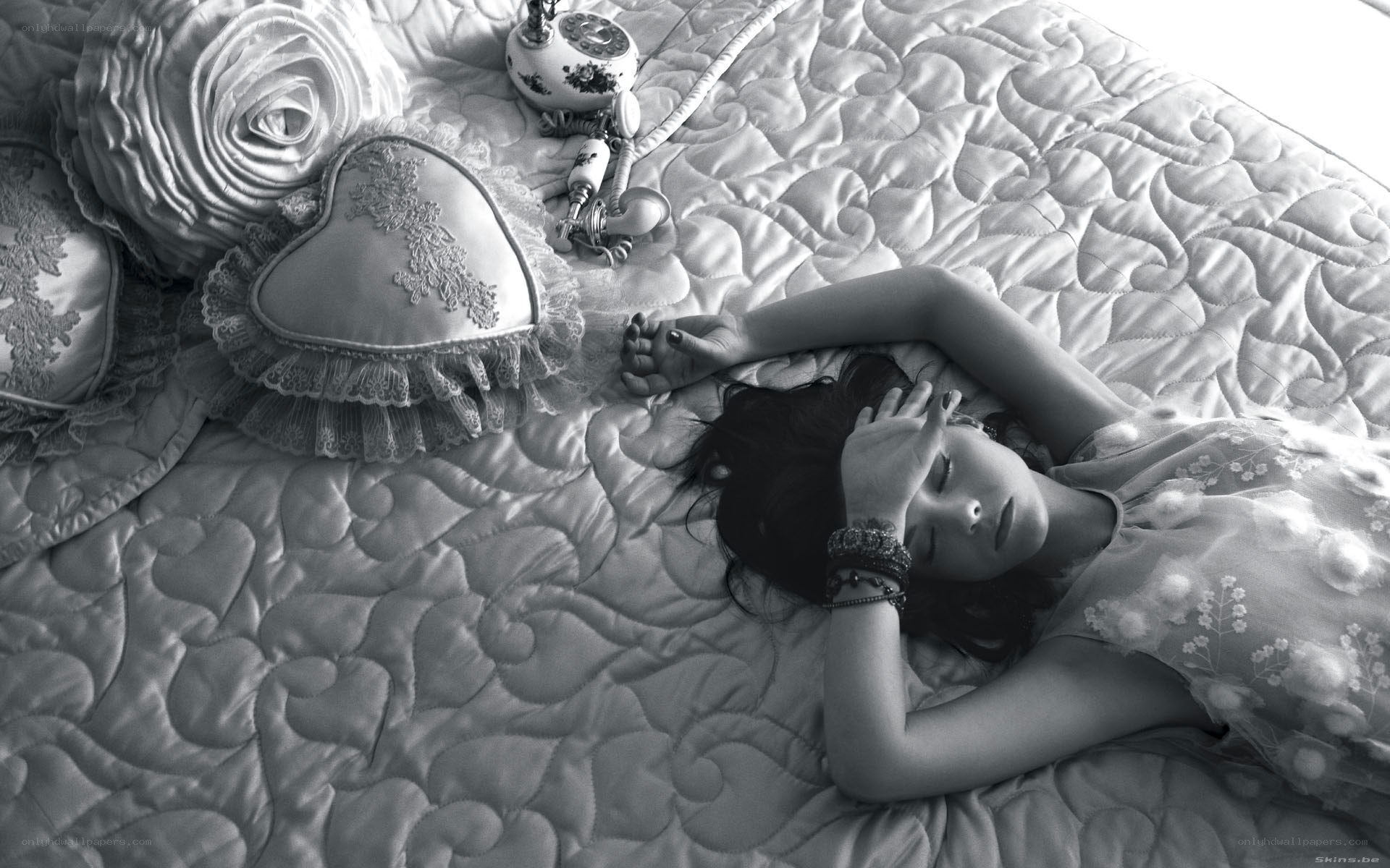 woman resting on a bed