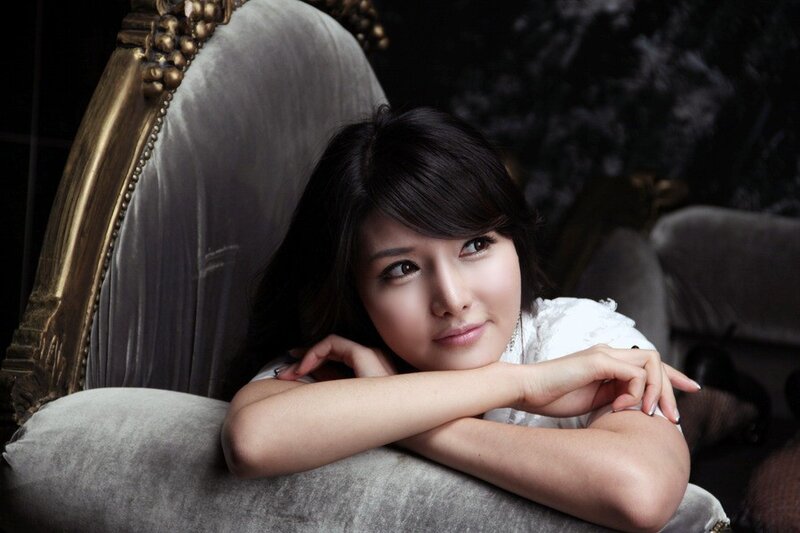 woman resting on a chair