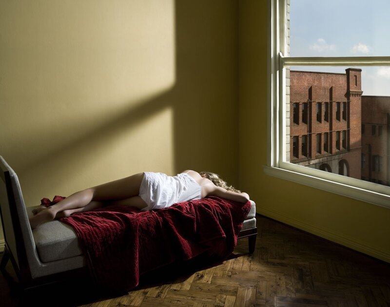 Woman resting on a chaise lounge