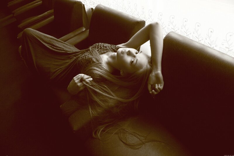 woman resting on a couch
