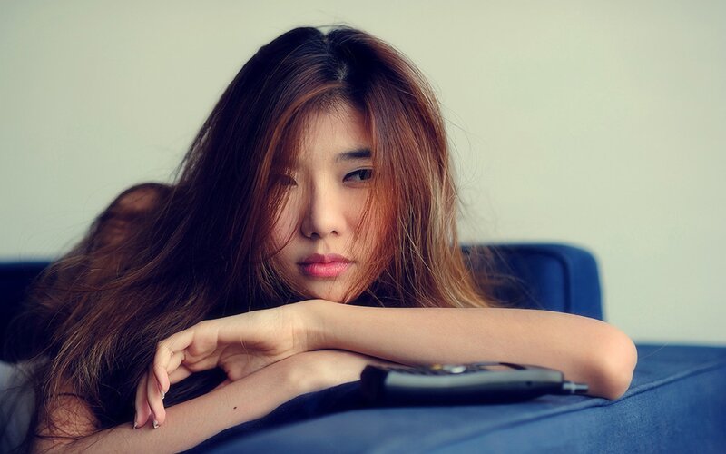 woman resting on a couch