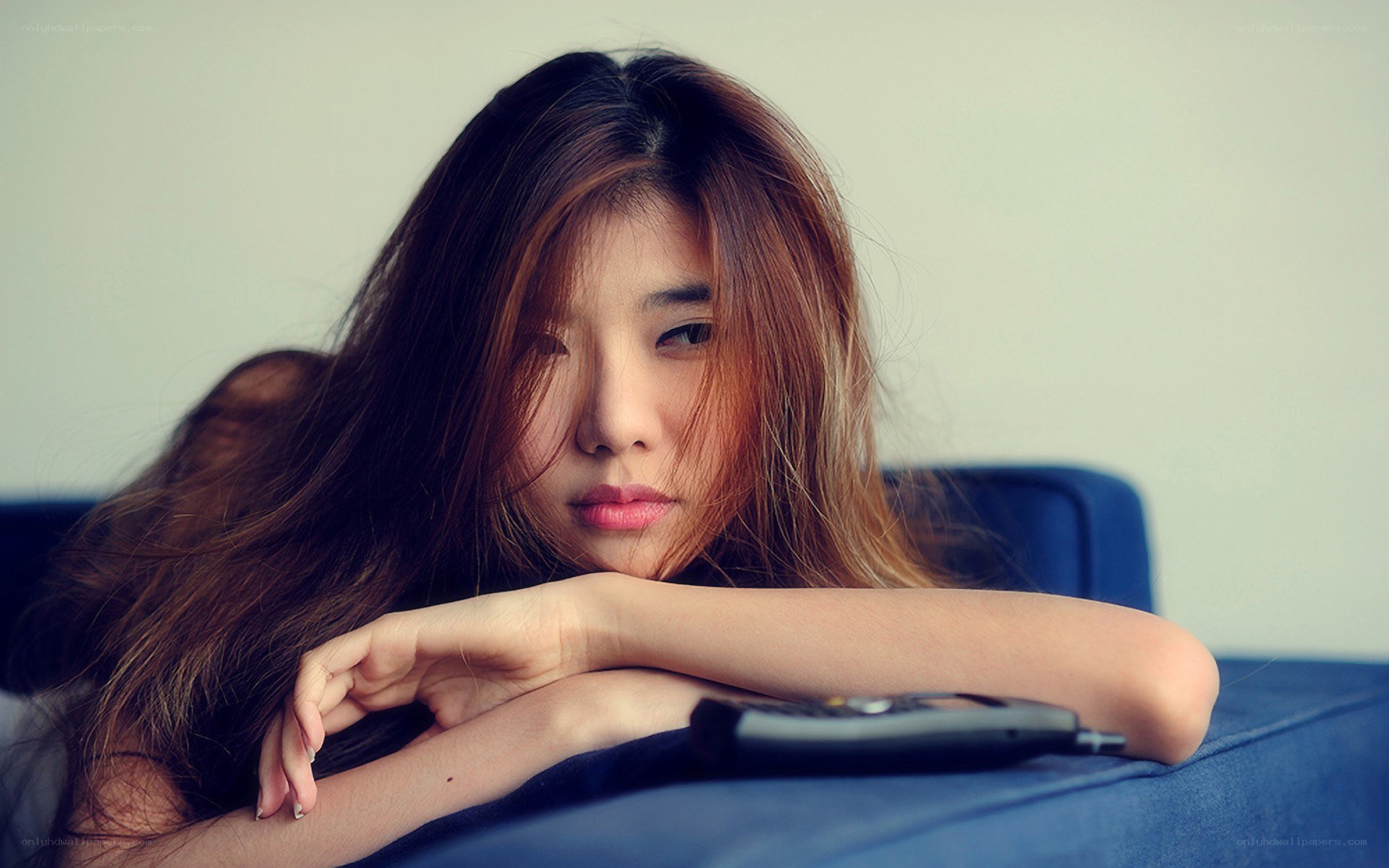 woman resting on a couch