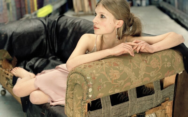 woman resting on a couch