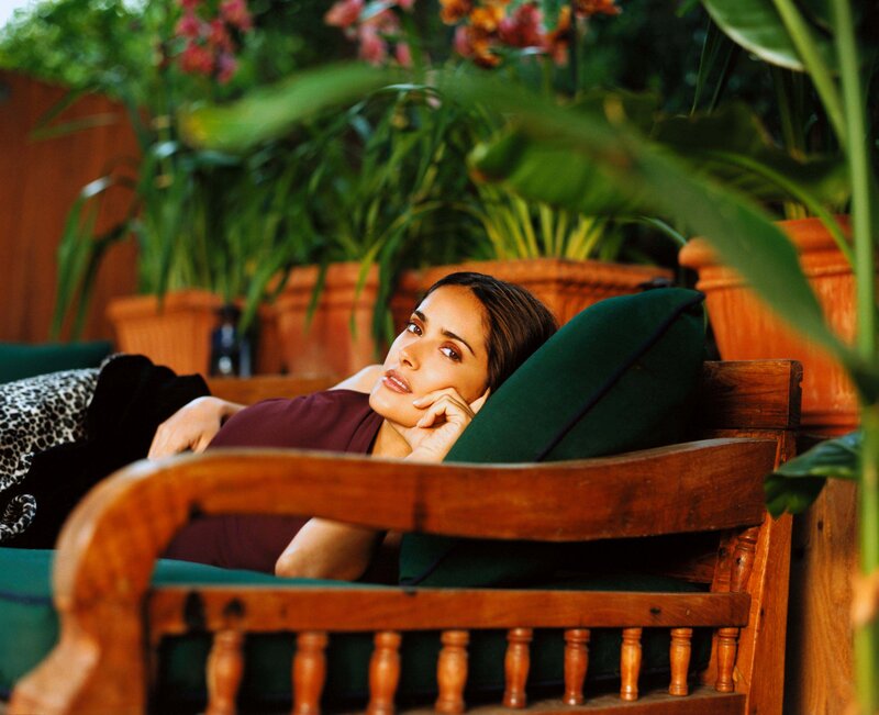 woman resting on a garden bench