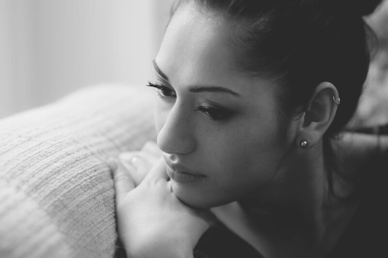 woman resting on a pillow