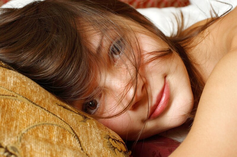 woman resting on a pillow