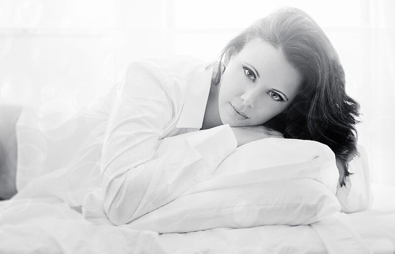 woman resting on a pillow
