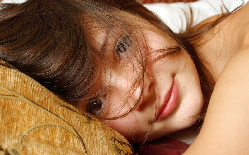 woman resting on a pillow