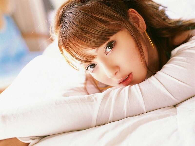 woman resting on a pillow