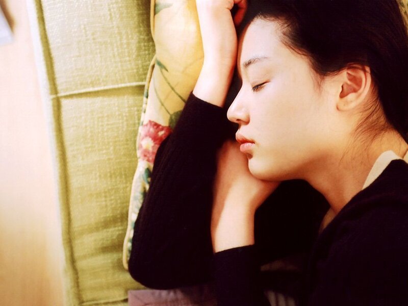 woman resting on a pillow