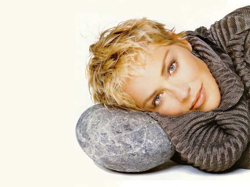 woman resting on a rock