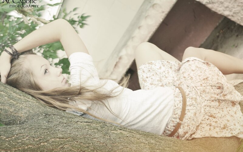 woman resting on a tree branch