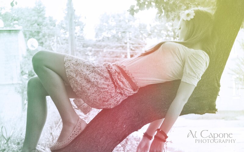 woman resting on a tree