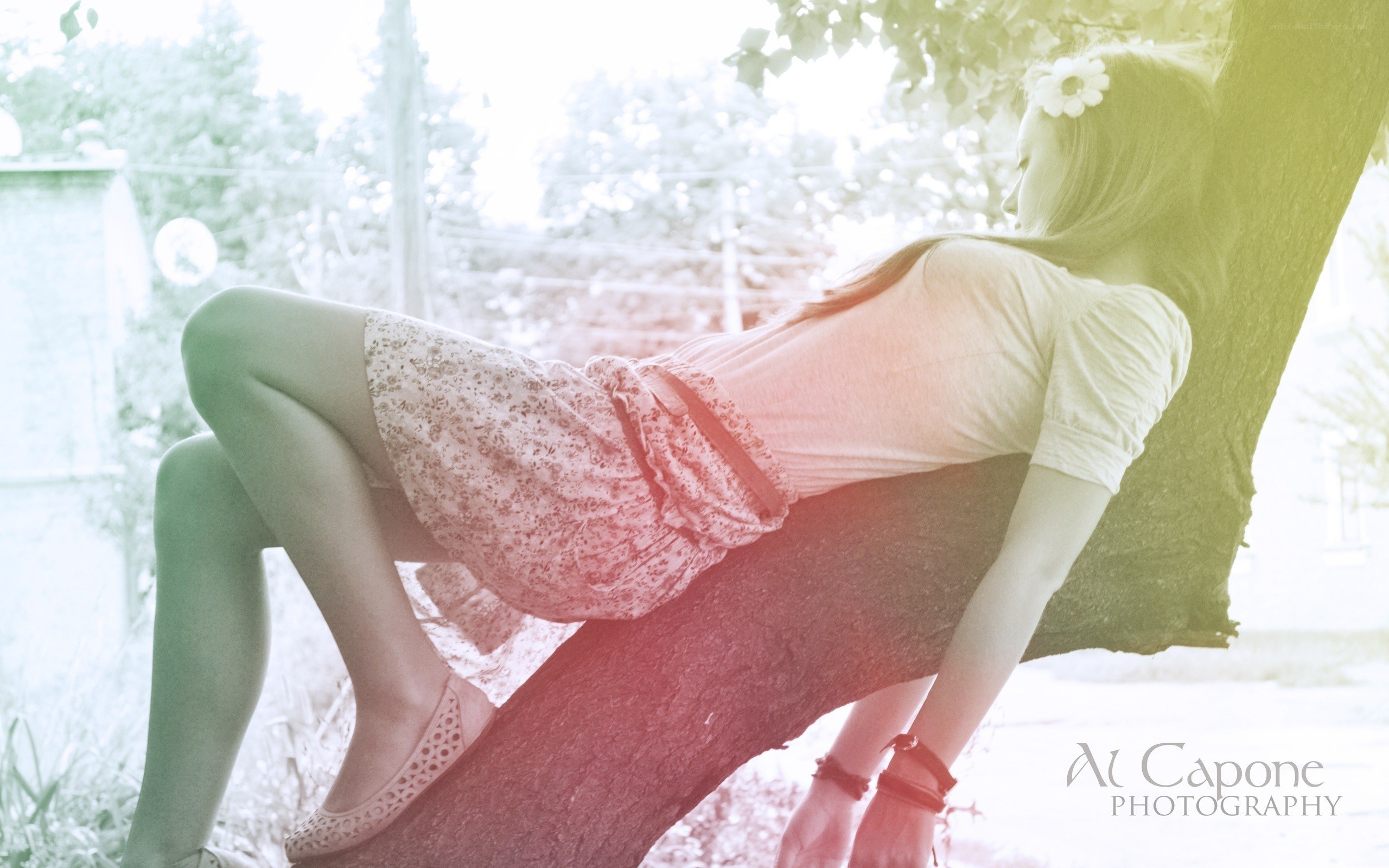 woman resting on a tree