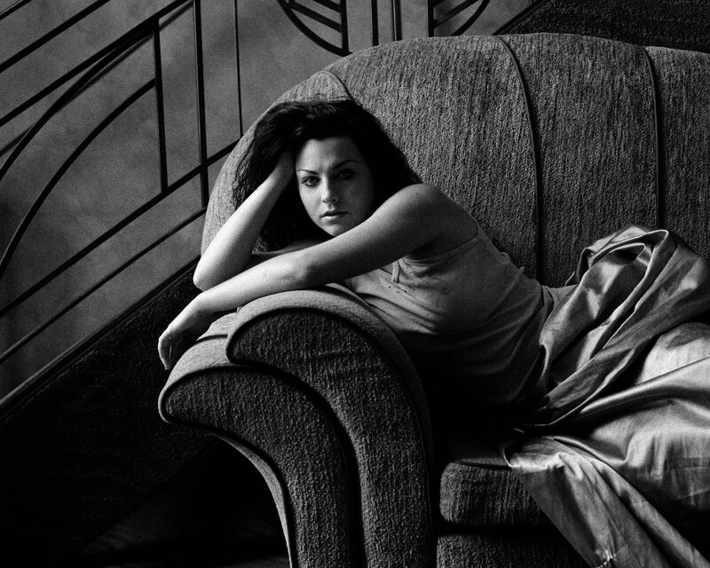 woman resting on armchair