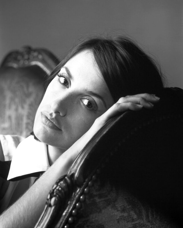woman resting on armchair