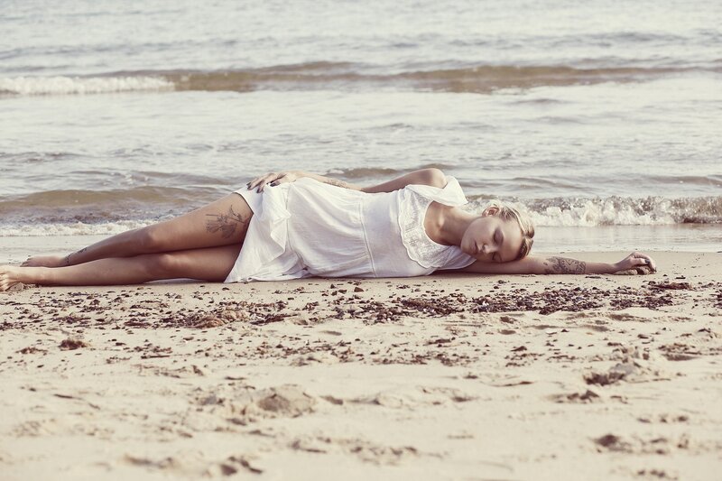 Woman resting on beach