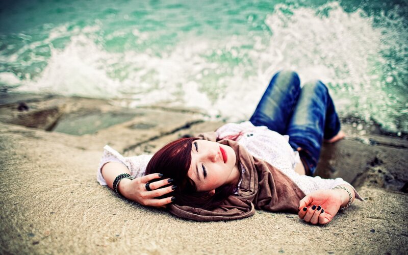 woman resting on beach