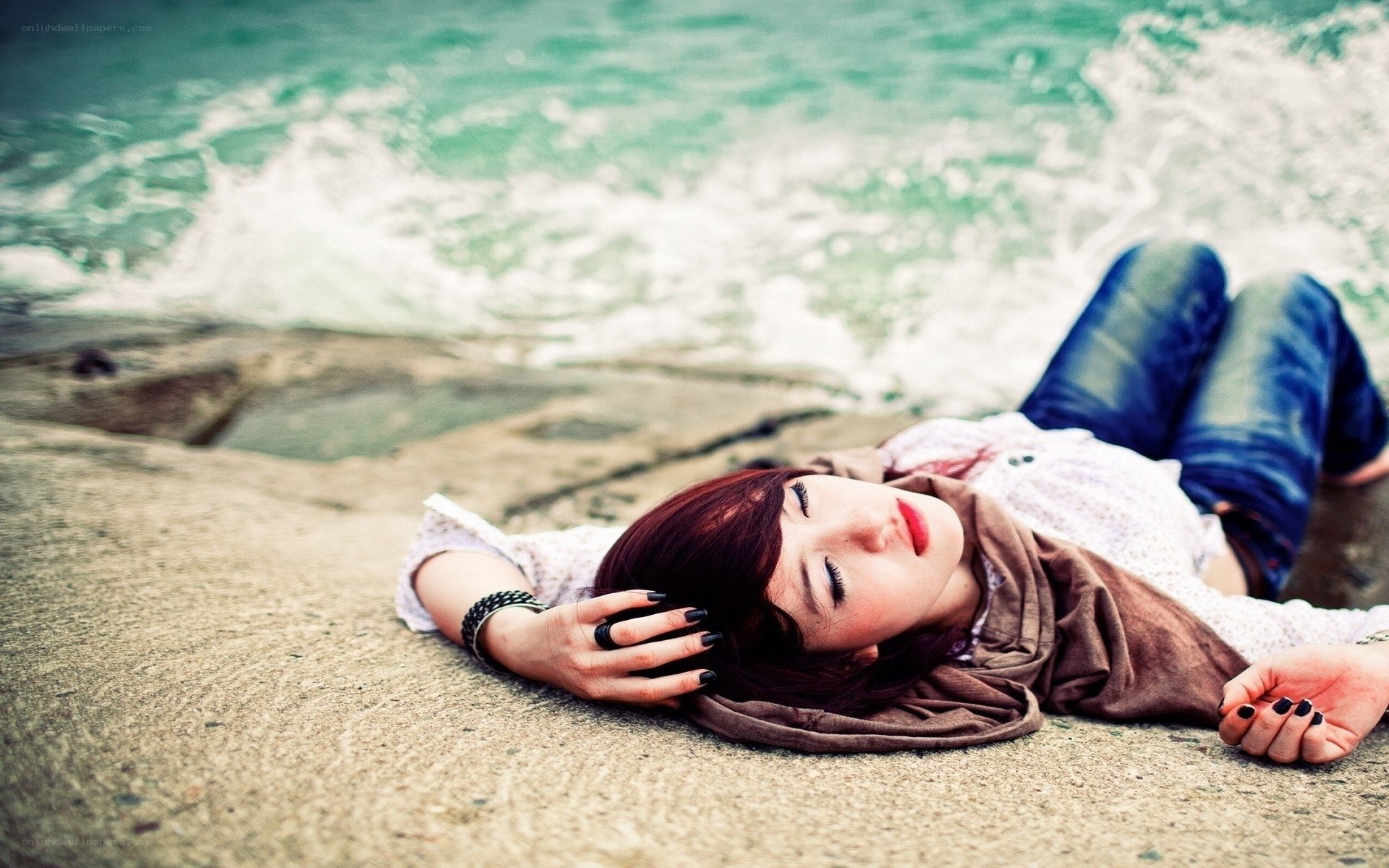 Woman resting on beach