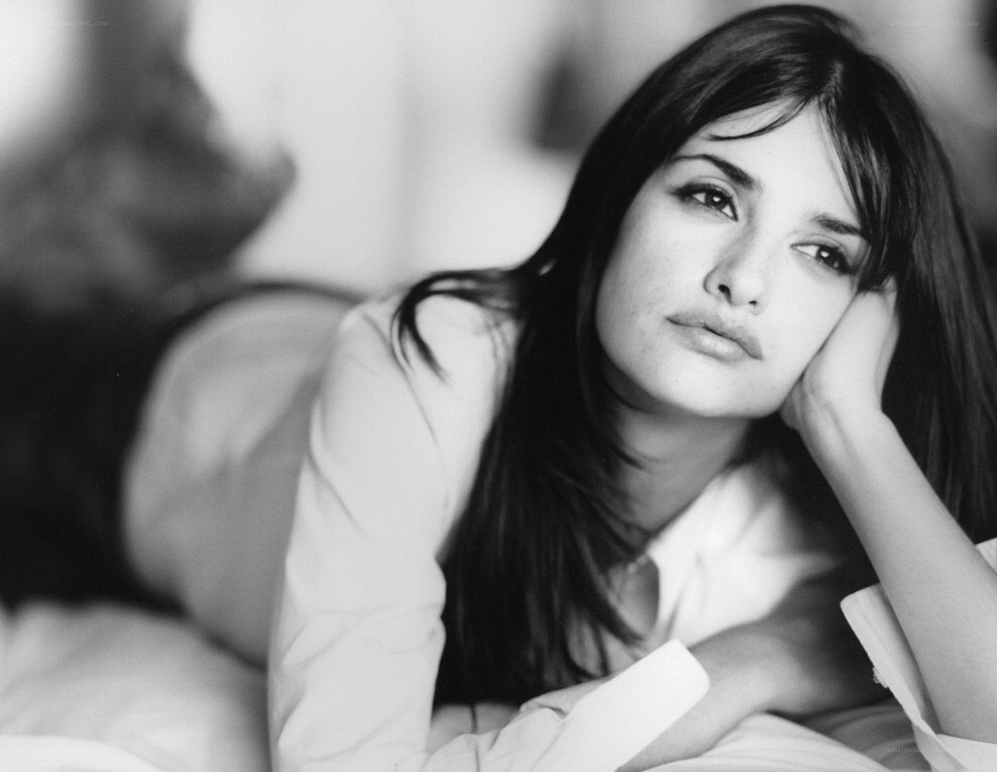 woman resting on bed