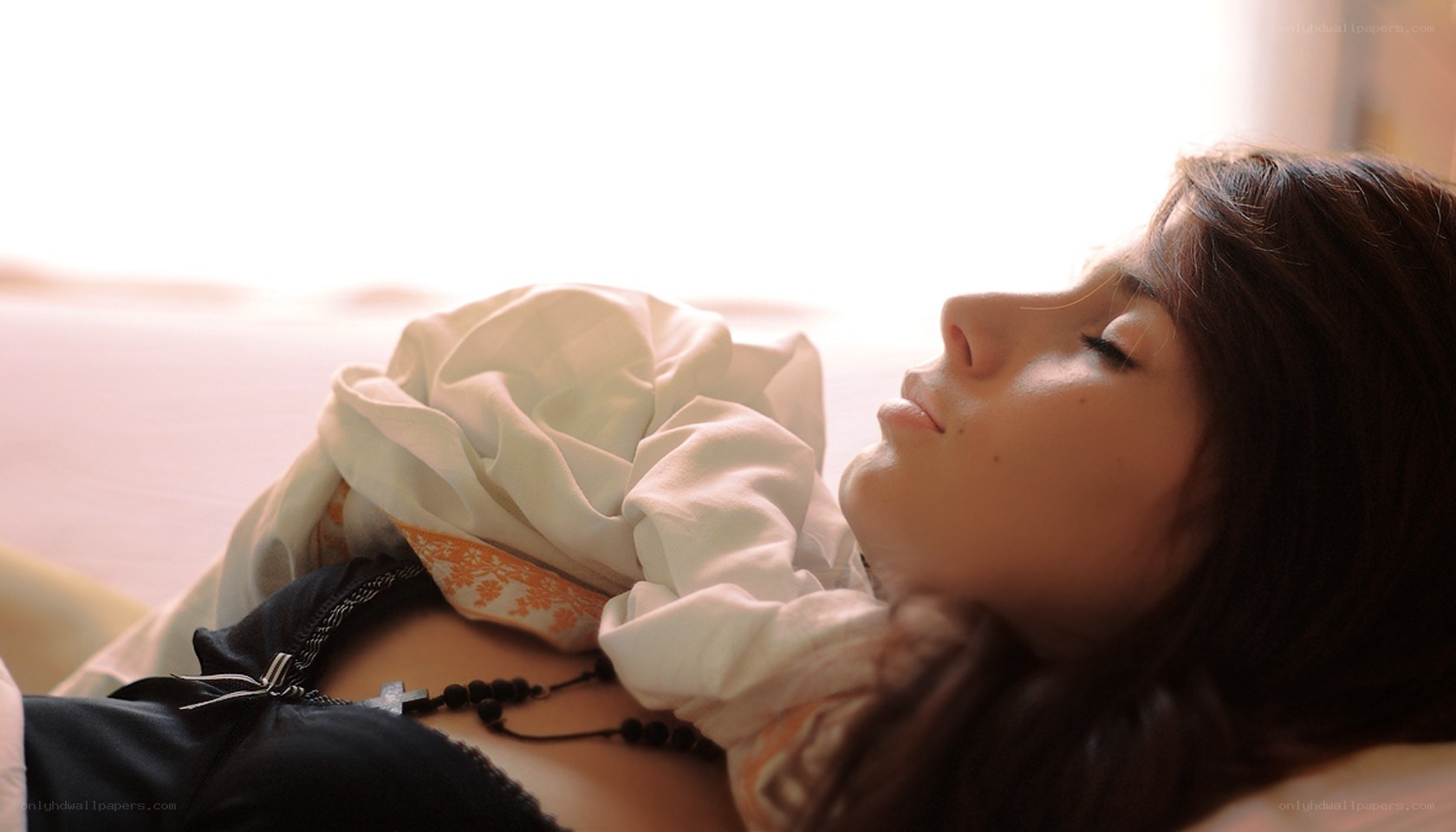 woman resting on bed
