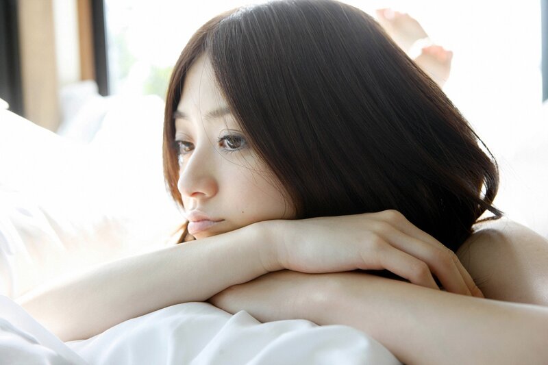 woman resting on bed