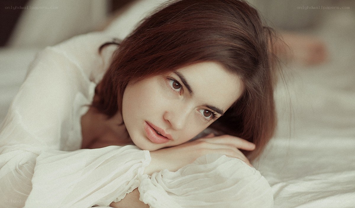woman resting on bed