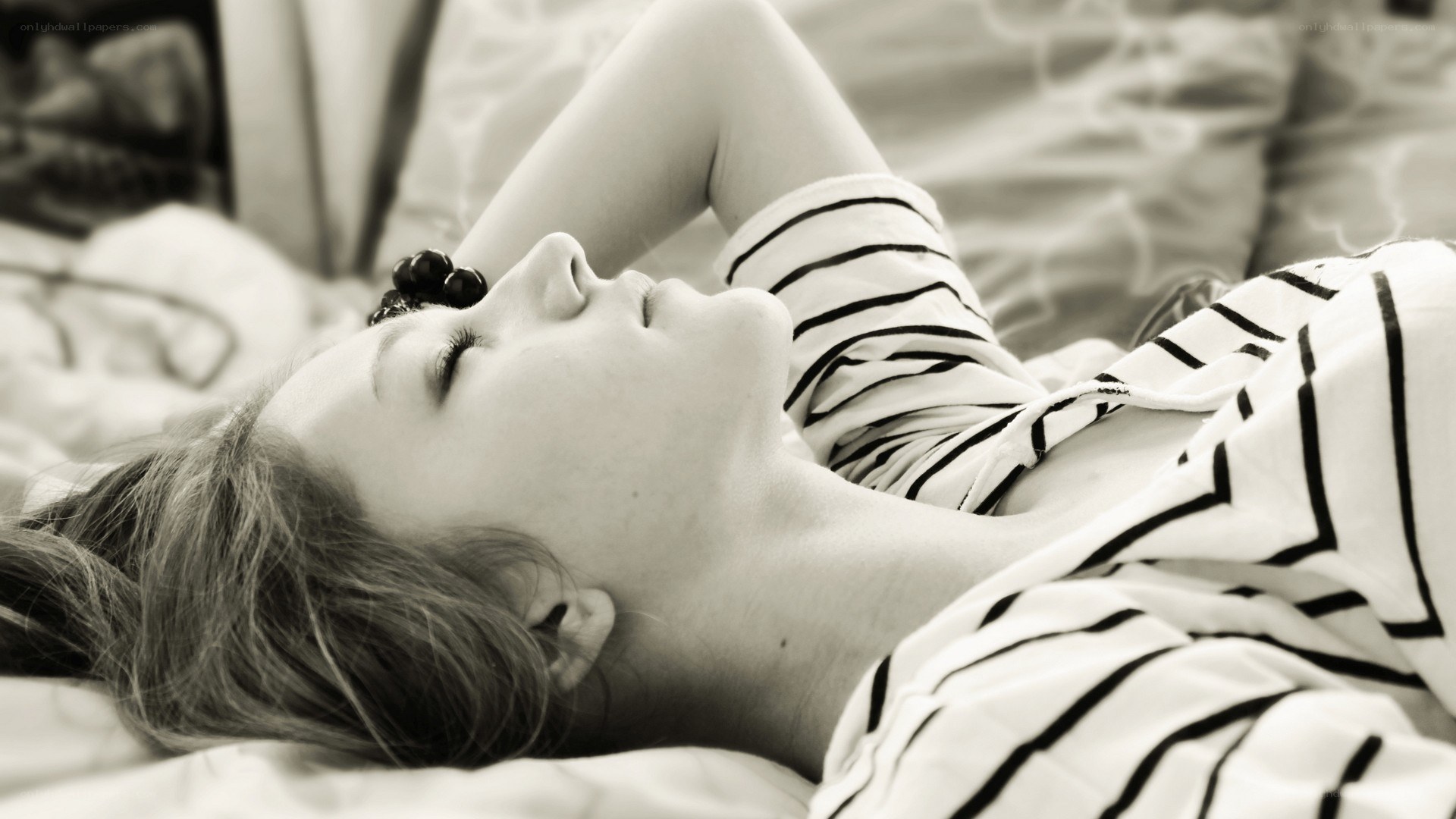 woman resting on bed