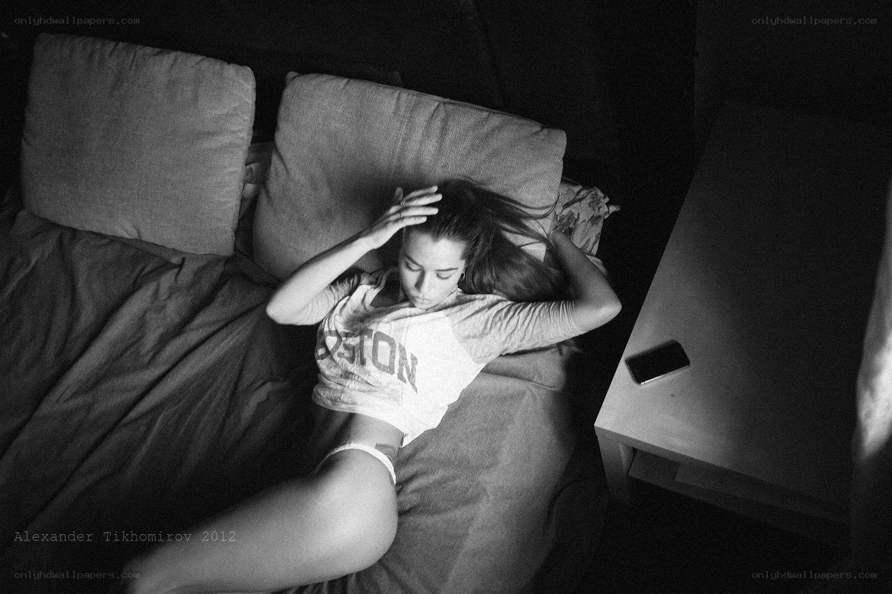 woman resting on bed