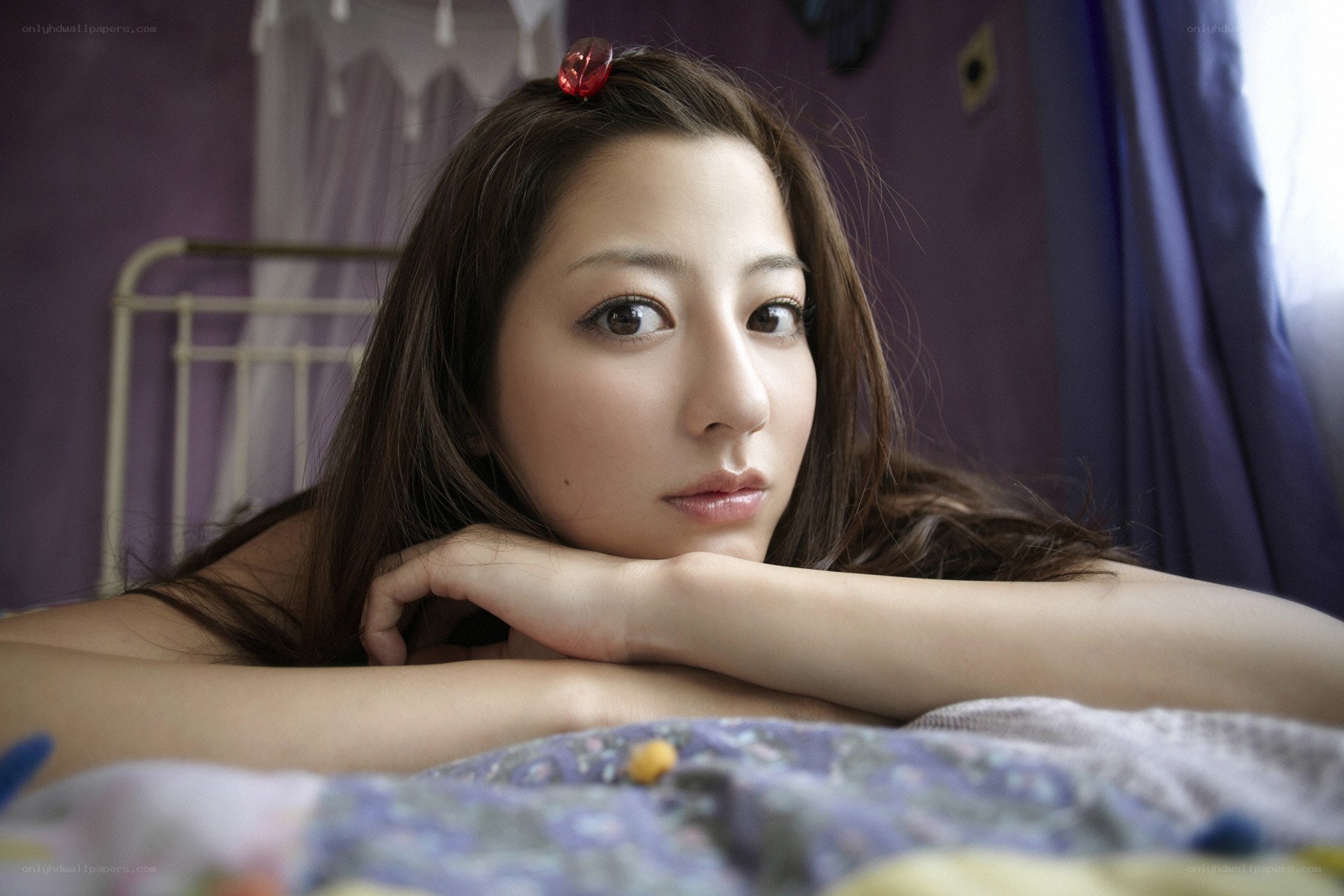 woman resting on bed