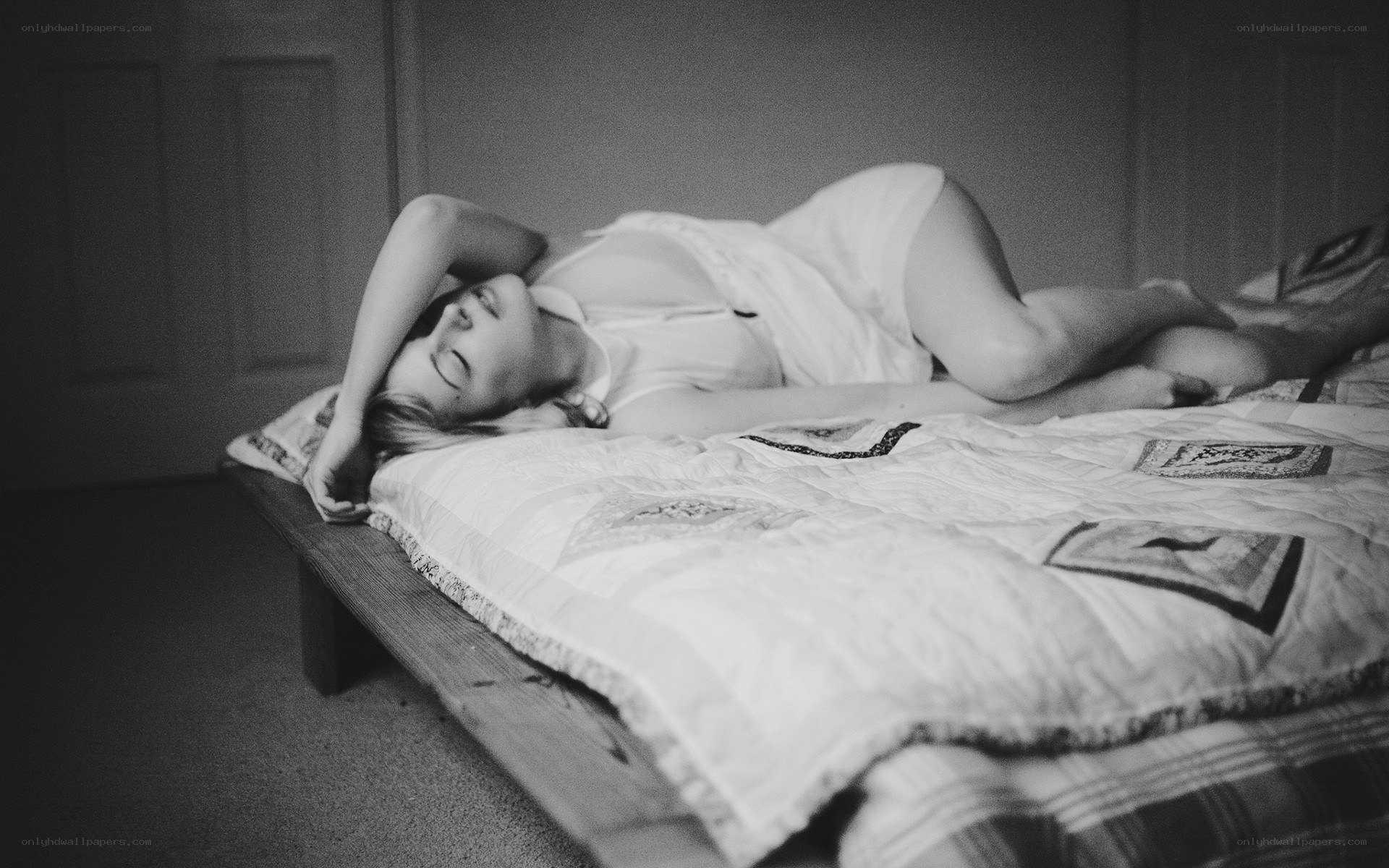 woman resting on bed