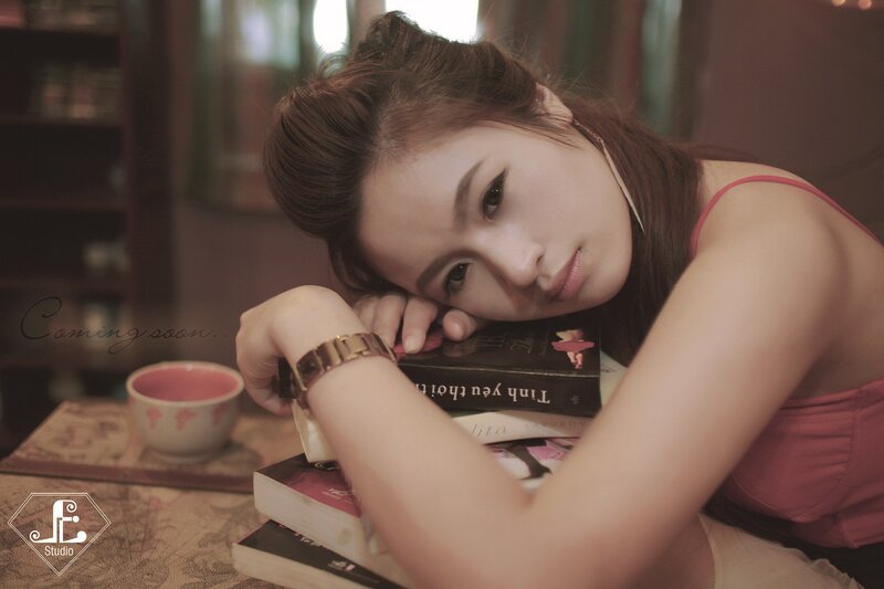 woman resting on books