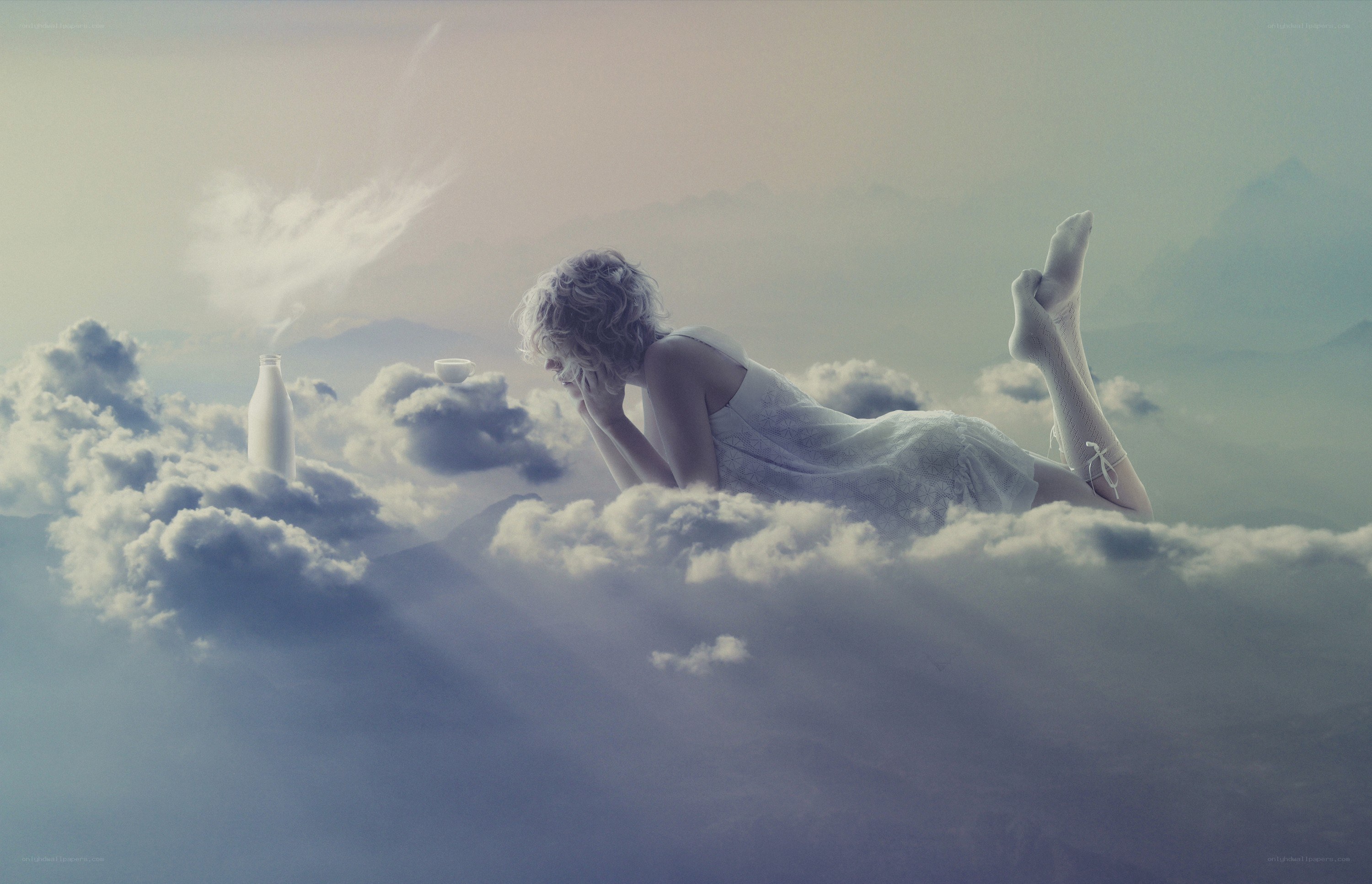 woman resting on clouds